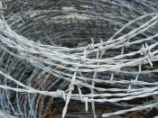 English: Roll of barbed wire on a farm