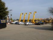 English: SJH Plant Sales. JCB Loadalls and diggers lined up for inspection at the Plant Sales company.