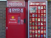 English: a RedBox video rental kiosk located on the east facing external wall of a Walgreens in Macomb, Illinois 61455 taken while facing west bound