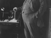 U.S. President William Howard Taft in 1908, posed standing with his hand on a telephone.