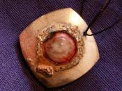 English: Ruby eye pendant from an ancient civilisation in Mesopotamia. Adilnor Collection.