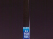 The Washington Monument illuminated with a message from Greenpeace criticizing American environmental policy