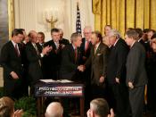 United States President George W. Bush shakes hands with U.S. Senator Arlen Specter after signing H.R. 3199, the USA PATRIOT Improvement and Reauthorization Act of 2005 in the East Room of the White House