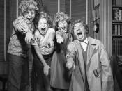 Harpo Marx and three of his children wearing Harpo wigs in Los Angeles, 1954