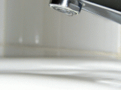 Water dropping from a tap.