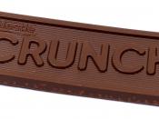English: Nestle Crunch bar whole, showing logo of product in the actual chocolate.