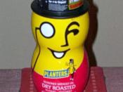 A container of Planters Dry Roasted Peanuts