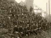 Upper Peninsula Michigan, USA, 1905. Miners pose with lunch pails in hand on a pile of 