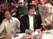 English: Picture of imran khan giving autographs at membership camp of Pakistan Tehreek-e-Insaf. It has been taken by the Administration of www.insaf.pk, who have allowed to use it.