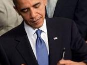 Barack Obama signing the Patient Protection and Affordable Care Act at the White House