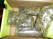 English: Four ounces of low-grade marijuana, usually referred to as a quarter-pound or QP.