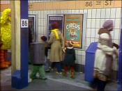 Christmas Eve on Sesame Street scene with Oscar (in garbage can) and Big Bird at the 86th Street station