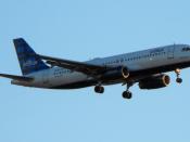 English: JetBlue Airbus 320 coming in to land at Oakland Airport