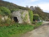 English: Two of the lime kilns at Porth Clais Limestone was brought in by boat, burnt in the kilns on the quayside to produce lime which was spread on the fields nearby, the resulting increase in pH (alkalinity) was sufficient to liberate mineral nutrient
