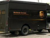English: A United Parcel Service Van (package car in their terminology) from the rear quarter. Location of image unknown. Image cropped from original