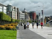 English: Jogging Along Four young men taking some exercise on the Clyde Walkway at Broomielaw in central Glasgow.