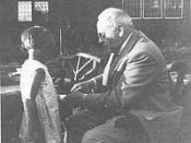 Alfred Adler Bandaging a Child's Hand