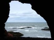 English: Masons' Cave, Cove Haven. Cove Haven was once a refuge for smugglers. Within it lies the Masons' Cave, so called because St Thomas Lodge met in it annually on St John's Day for the admission of members. This is recorded in the Old Statistical Acc