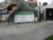 English: Photograph of the entrance to the Dinny the dinosaur exhibit at Cabazon, California. The attraction questions the theory of evolution and promotes creationism.