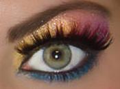 mac cosmetics rainbow eyeshadow fake eyelashes on a green eye