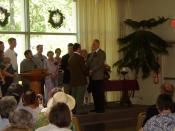 A same-sex couple exchanging wedding vows in an Unitarian Universalist Fellowship.