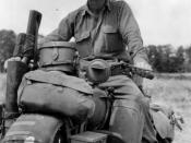 US Army Signal Corps Photo, see http://www.theliberator.be/myliberator.htm Pvt Robert J Vance, from Portland, Oregon, riding his bike as a messenger of the 33rd Armored Regiment of the 3rd Armored Division in the fields of Normandy in late July, 1944.