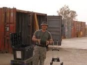 GI loads a shipping container. 