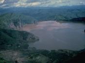 Lake Nyos is the most renowned of the numerous maars and basaltic cinder cones associated with the deeply dissected Mount Oku massif.