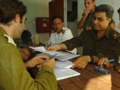 August 16, 2005. Israeli soldiers regularly meet with the Palestinian Police stationed at the Erez District Coordination Office. Pictured: Israeli and Palestinian officers hold a field situation assessment in preparation for Israel's 2005 Gaza Disengageme