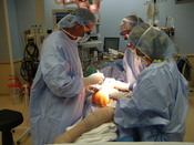 English: A orthopedic surgeon preforming a limb salvage at the Children's Hospital (Aurora, Colorado).