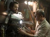 Shaun Toub as Yinsen helps Tony Stark (Robert Downey, Jr.) with the makeshift Mark I Armor in the 2008 Iron Man film.