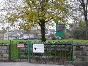 English: Entrance to Memorial Gardens This gate on Wakefield Road leads to a pleasant riverside park. The white notice says this is a 