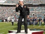 U.S. Navy Musician Third Class and American Idol finalist Phil Stacey sings God Bless the USA during the halftime show of the Jacksonville Jaguars vs. San Diego Chargers football game in Jacksonville, Fla., Nov. 18, 2007. (U.S. Navy photo by Chief Mass Co