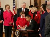Surrounded by leaders like House Speaker Nancy Pelosi and Secretary of State Hillary Clinton, and with the new law’s namesake, Lilly Ledbetter, at his side, President Barack Obama signs into law the Lilly Ledbetter Fair Pay Act -- a powerful tool to fight