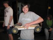 English: A student at Northfield School of Arts and Technology and his mousetrap-powered car.