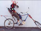 Photo of man in demon costume on a bicycle. chunk666
