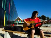 English: Student playing guitar at Albany Senior High School, New Zealand.