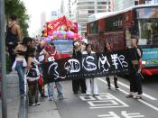 BDSM Company, part of the 2005 parade, sharing the road with cars.