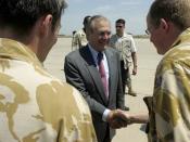 English: Baghdad, Iraq (April 27, 2006) - Secretary of Defense Donald H. Rumsfeld, center, greets two British servicemembers at the Baghdad International Airport in Iraq. Rumsfeld and Secretary of State Condoleezza Rice made an unannounced visit to Iraq t