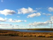 English: Whitelee's wind farm with Arran in the background