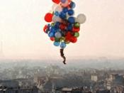 The balloons in Paris take Pascal on a cluster balloon ride over the city.