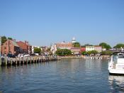 English: The dock or harbor in Annapolis, Maryland. Dock Street is just out of the frame of the photo to the right. Folks leaving their boats tied up here would step right out into the street. The Maryland State Capitol is the tall tower in the distance. 