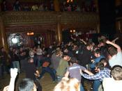 Audience members moshing at a Dillinger Escape Plan show.