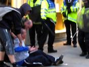 Ian Tomlinson after being pushed to the ground by police in London (2009). He collapsed and died soon after.