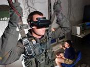 U.S. Navy personnel using a VR parachute trainer