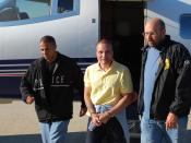Juan Carlos Ramirez Abadia, escorted by two DEA agents after being extradited from Colombia.