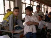 English: Deaf students inside the classroom of a special school for the hearing-impaired in Baghdad, Iraq (April 2004). Photo by Peter Rimar.