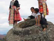 Hmong Girls climbing on one of the jars at Site 1