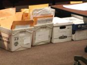 English: Boxes of challenged ballots sorted by county