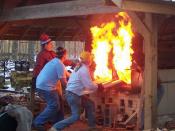 English: A team of craftsmen at Wheaton Arts in Millville, NJ loading a wood-fired pottery kiln
